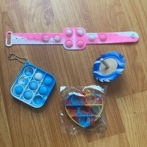Fidget Combo with two Normal Pop its, One Pop it Watch, and a Spinning Top